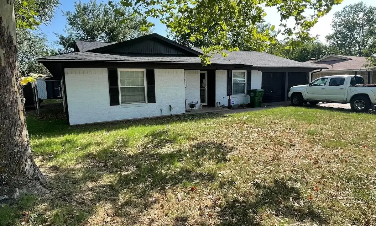 Professional roofing crew working on a residential roof in Sanford