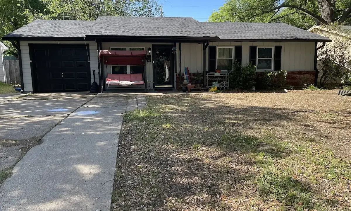 Asphalt Shingle Roof Repair crew at work on a residential roof in Sanford